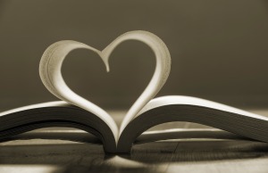Open book with pages forming heart shape